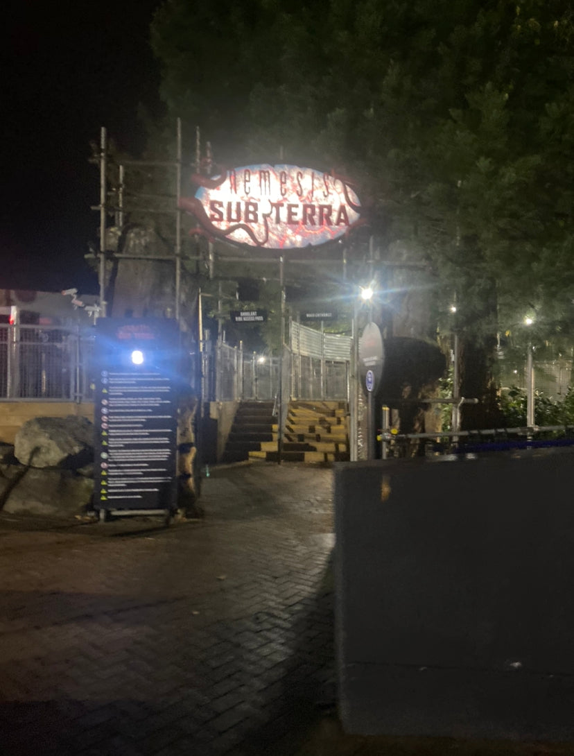 Nemesis Sub-Terra illuminated attraction logo photographed during Scarefest at Alton Towers